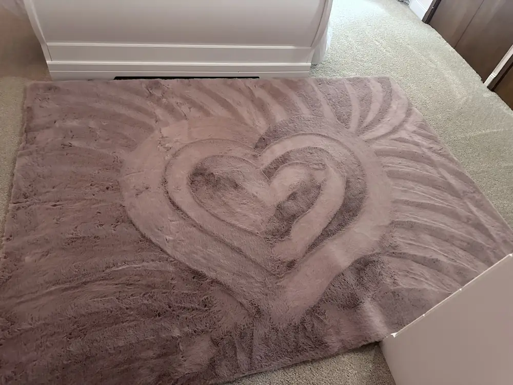 Freshly vacuumed carpet with a heart pattern