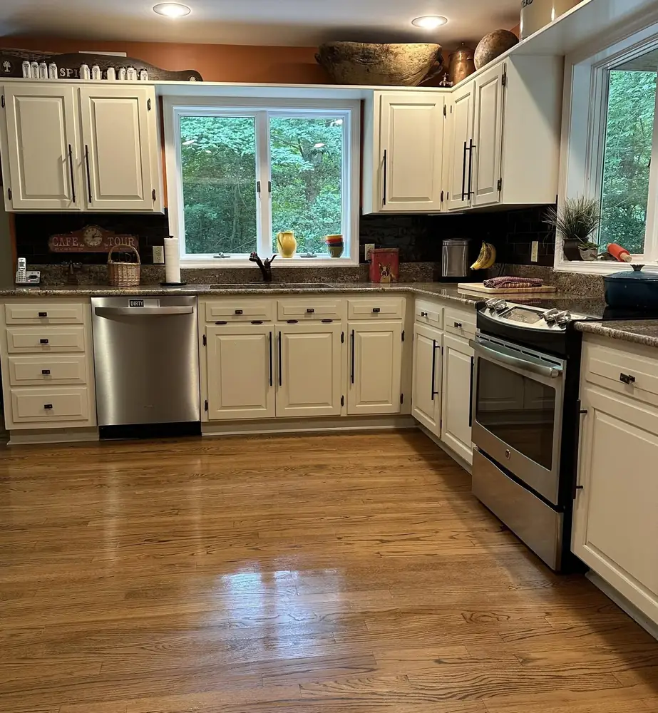 Clean white kitchen with hardwood floors